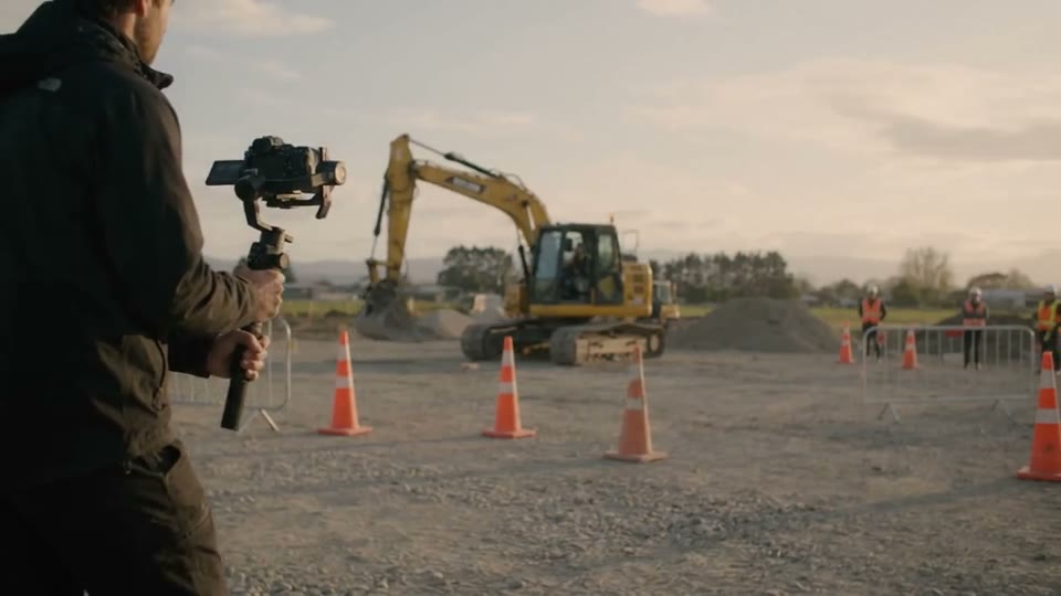 Camera operator recording an active construction project